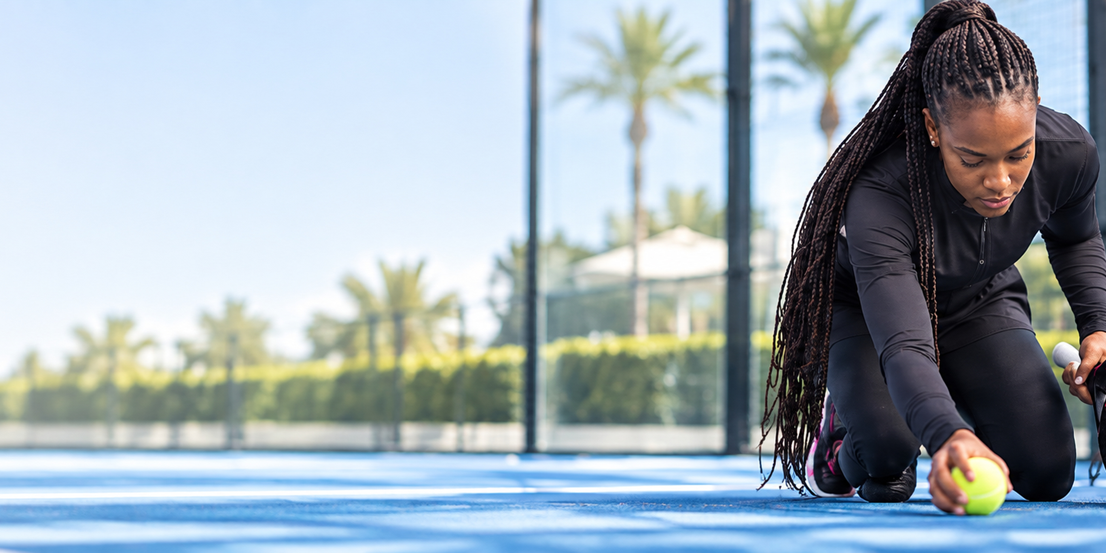 Black padel athlete preparing on court