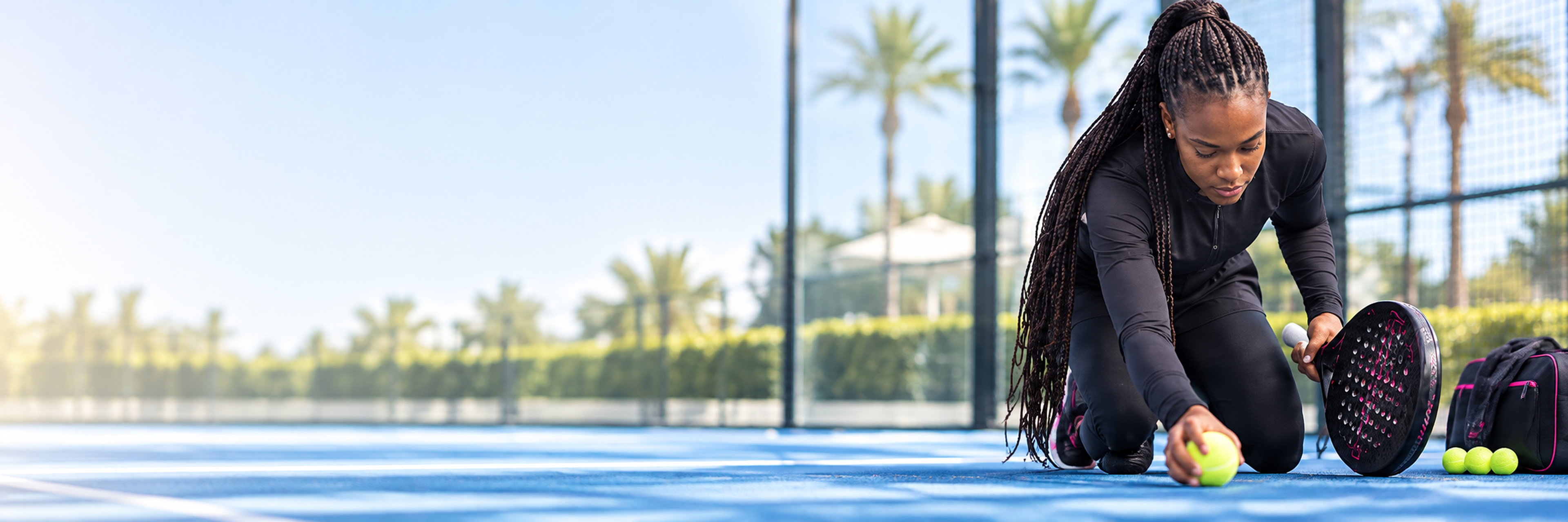 Black padel athlete preparing on court